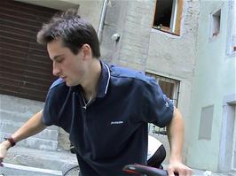 Tao makes final adjustments to his bike at the back of Solothurn Youth Hostel